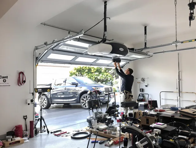 La Verne Garage Door Repair specialist installing smart garage door opener system in La Verne home